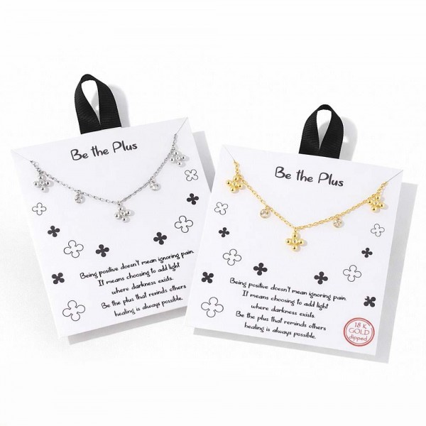 Dainty Chain Link Necklace Featuring Metal Tone Bubble Plus Sign & Cubic Zirconia Charms 					
					
- Approximately 16" L					
- Extender 2" L					
- Hypoallergenic Brass Base					
- 18K Gold Dipped					
- Card: "Being positive doesn't mean ignoring pain. It means choosing to add light where darkness exists. Be the plus that remind others healing is always possible."					
					