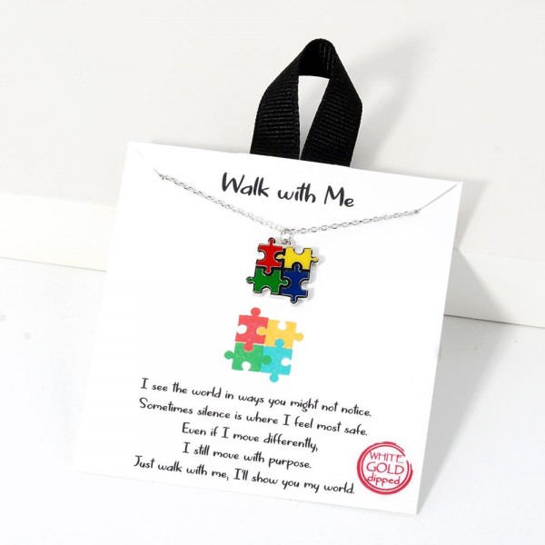 Dainty Chain Link Necklace Featuring Enamel Puzzle Pieces Pendant 			
					
- Approximately 16" L					
- Extender 2" L					
- Hypoallergenic Brass Base					
- 18K Gold Dipped					
- Card: "I see the world in ways you might not notice. Sometimes silence is where I feel most safe. Even if I move differently, I still move with purpose. Just walk with me, I'll show you my world."			