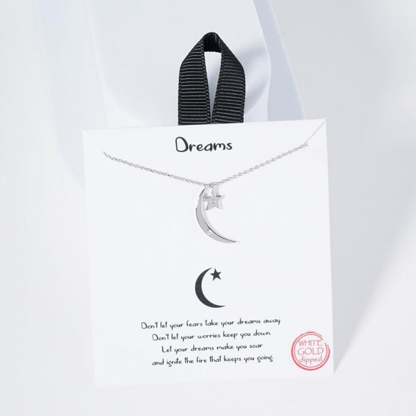 Dainty Chain Link Necklace Featuring Metal Tone Star & Moon Pendants 					
					
- Approximately 16" L					
- Extender 2" L					
- Hypoallergenic Brass Base					
- 18K Gold Dipped					
- Card: "Don't let your fears take your dreams away. Don't let your worries keep you down. Let your dreams make you soar and ignite the fire that keeps you going."					