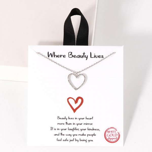 Dainty Chain Link Necklace Featuring Cubic Zirconia Heart Pendant

- Approximately 16" L
- Extender 2" L
- Hypoallergenic Brass Base
- 18K Gold or White Gold Dipped
- Made in Korea
-Card: " Beauty lives in your heart more than in your mirror. It is in your laughter, your kindness, and the way you make people feel safe just by being you."