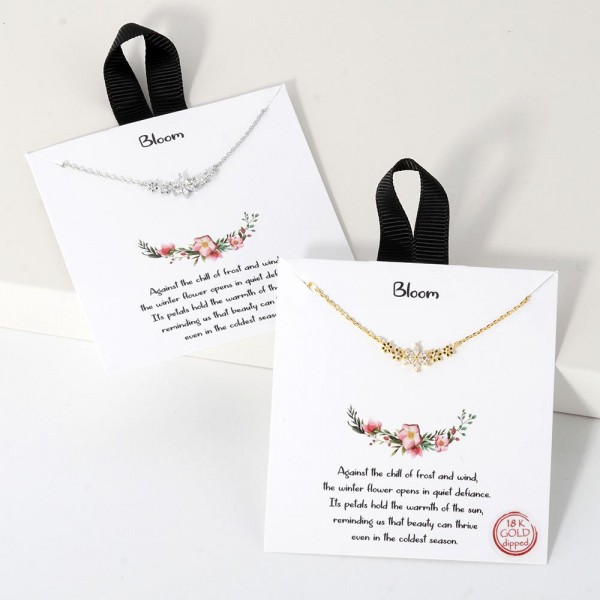 Dainty Chain Link Necklace Featuring Cubic Zirconia Flower Cluster Pendant 				
					
- Approximately 16" L					
- Extender 2" L					
- Hypoallergenic Brass Base					
- 18K Gold Dipped					
- Card: "Against the chill of frost and wind, the winter flower opens in quiet defiance. Its petals hold the warmth of the fun, reminding us that beauty can thrive even in the coldest season."					