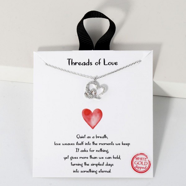 Dainty Chain Link Necklace Featuring Metal Tone Branch Pendant With Pearl & Cubic Zirconia Accents						
						
- Approximately 16" L						
- Extender 2" L						
- Hypoallergenic Brass Base						
- 18K Gold Dipped						
- Card: "Quiet as a breath, love weaves itself into the moments we keep. It asks for nothing, yet gives more than we can hold, turning the simplest days into something eternal."						