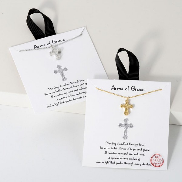 Dainty Chain Link Necklace Featuring Textured Metal Cross Pendant 				
					
- Approximately 16" L					
- Extender 2" L					
- Hypoallergenic Brass Base					
- 18K Gold Dipped					
- Card: "Standing steadfast through time, the cross holds stories of hope ands grace. It reaches upward and outward, a symbol of love enduring, and a light that guides through every shadow."