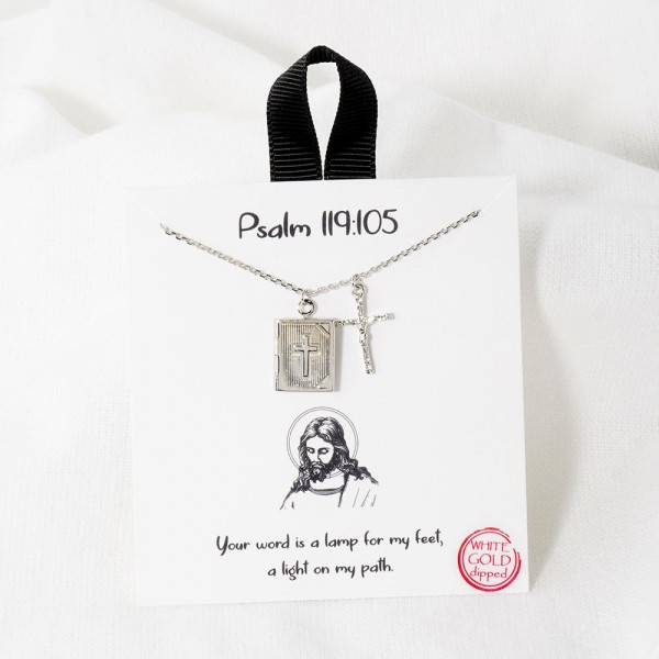 Dainty Chain Link Necklace Featuring Cross And Bible Pendant 

- Approximately 16" L
- Extender 2" L
- Hypoallergenic Brass Base
- 18K Gold Dipped
- Card: " Your word is a lamp for my feet, a light on my path" 
