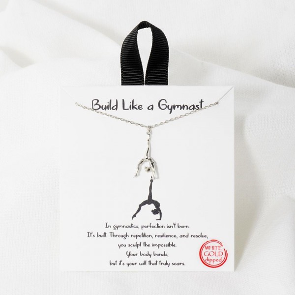 Dainty Chain Link Necklace Featuring Gymnast Pendant

- Approximately 16" L
- Extender 2" L
- Hypoallergenic Brass Base
- 18K Gold or White Gold Dipped
- Made in Korea
-Card: " In Gymnastics, Perfection isn't born. Its built. Through repetition, resilience, and resolve, you sculpt the impossible.Your body bends, but its your will that truly soars."