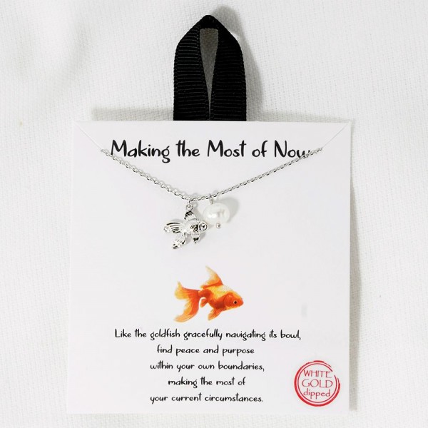 Dainty Chain Link Necklace Featuring Metal Tone Fish & Pearl Pendant 		
					
- Approximately 16" L					
- Extender 2" L					
- Hypoallergenic Brass Base					
- 18K Gold Dipped					
- Card: "Like the goldfish gracefully navigating its bowl, find peace and purpose within your own boundaries, making the most of your current circumstances."					