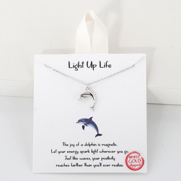 Dainty Chain Link Necklace Featuring Metal Tone Dolphin Pendant 					
					
- Approximately 16" L					
- Extender 2" L					
- Hypoallergenic Brass Base					
- 18K Gold Dipped					
- Card: "The joy of a dolphin is magnetic. Let your energy spark light wherever you go. Just like waves, your positivity reaches farther than you'll ever realize."					