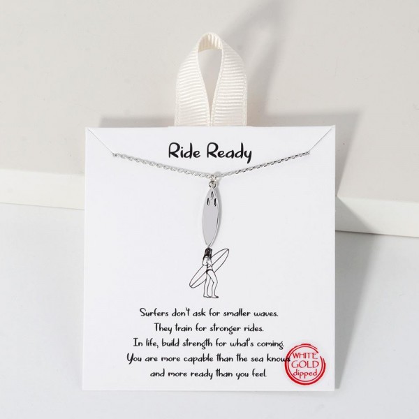 Dainty Chain Link Necklace Featuring Metal Tone Surfboard Pendant 						
						
- Approximately 16" L						
- Extender 2" L						
- Hypoallergenic Brass Base						
- 18K Gold Dipped						
- Card: "Surfers don't ask for smaller waves. They train for stronger rides. In life, build strength for what's coming. You are more capable than the sea knows and more ready than you feel."						