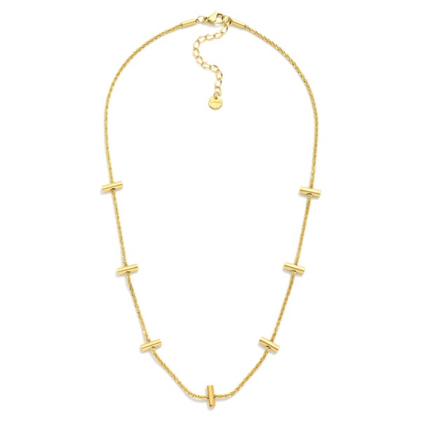 Twisted Chain Link Necklace Featuring Metal Tone Bar Stations 

- Stainless Steel
- Water Resistant
- Approximately 16" L
- Extender 2" L