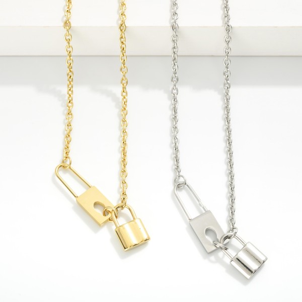 Chain Link Necklace Featuring Metal Tone Lock Pendant 

- Stainless Steel
- Water Resistant
- Approximately 16" L
- Extender 2" L