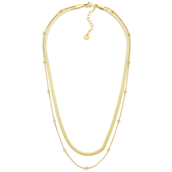 Layered Herringbone Chain & Snake Chain With Metal Tone Ball Station Necklace 

- Stainless Steel
- Water Resistant
- Approximately 16.5" L
- Extender 2" L