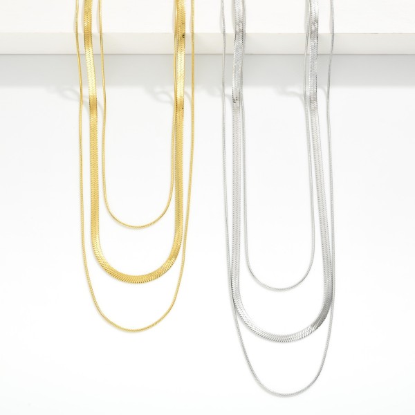 Layered Chain Link Necklace Featuring Snake & Herringbone Chains 

- Stainless Steel
- Water Resistant
- Approximately 16" L
- Extender 2" L