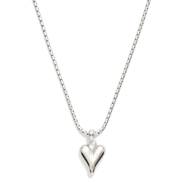 Box Chain Necklace Featuring Metal Tone Puffy Heart Pendant

- Stainless Steel
- Water Resistant
- Approximately 16" L
- Extender 2" L