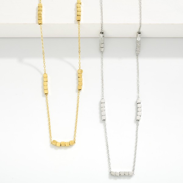 Chain Link Necklace Featuring Metal Tone Layered Square Bead Stations 

- Stainless Steel
- Water Resistant
- Approximately 16" L
- Extender 2" L