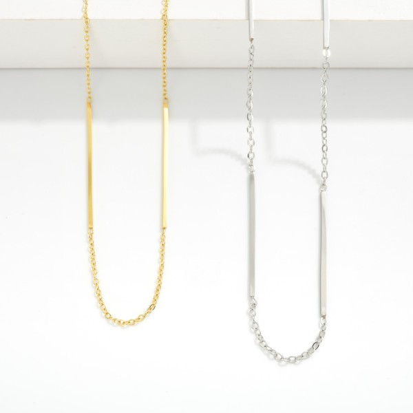 Chain Link Necklace With Metal Tone Bar Stations

- Stainless Steel
- Water Resistant
- Approximately 16" L
- Extender 2" L