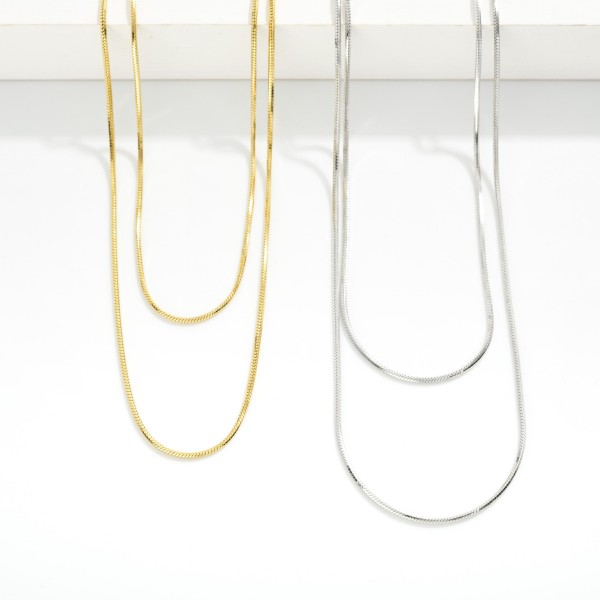 Layered Chain Link Necklace 

- Stainless Steel
- Water Resistant
- Approximately 16" L
- Extender 2" L