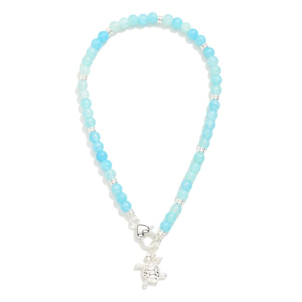 Beaded Necklace Featuring Metal Tone Turtle & Clasp Pendant 

- Approximately 14" L