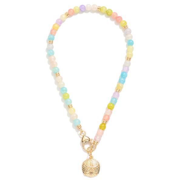 Beaded Necklace Featuring Metal Tone Sand Dollar & Clasp Pendant 

- Approximately 14" L