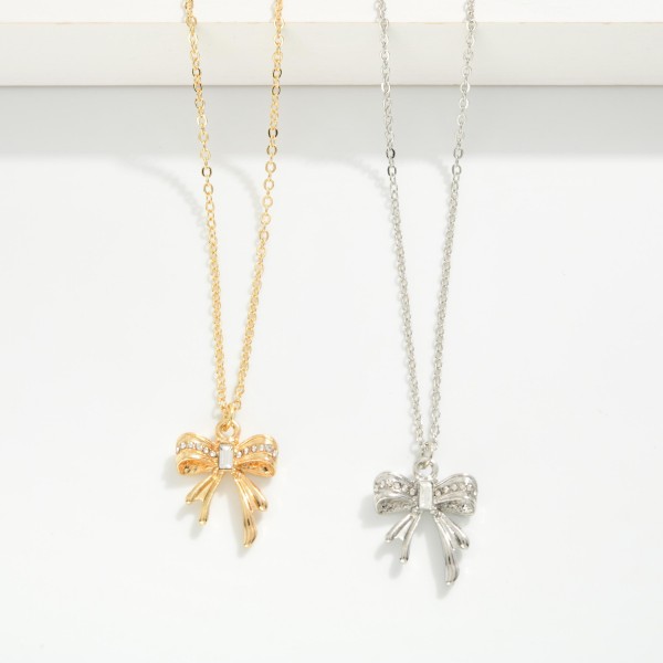 Chain Link Necklace Featuring Metal Tone Bow Pendant With Rhinestone Details 

- Approximately 14" L
- Extender 3" L