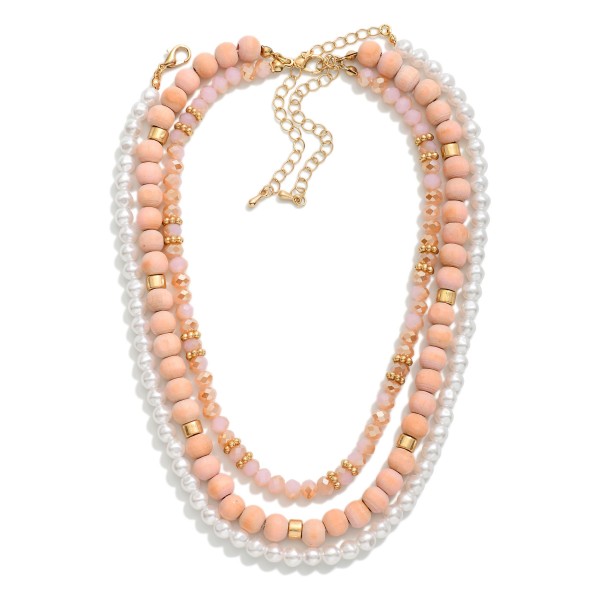 Layered Necklace Featuring Wood, Pearl, & Faceted Beads

- Approximately 14" L
- Extender 3" L