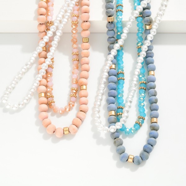 Layered Necklace Featuring Wood, Pearl, & Faceted Beads

- Approximately 14" L
- Extender 3" L