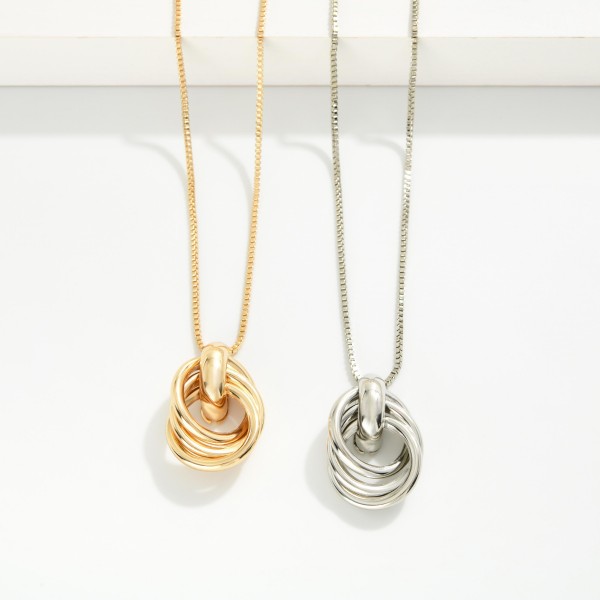Box Chain Necklace Featuring Intertwined Metal Hoops Pendant 

- Approximately 14" L
- Extender 3" L