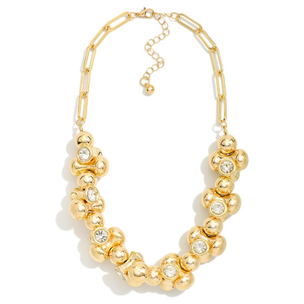 Chain Link Necklace Featuring Metal Tone Peanut Bead Necklace Featuring Rhinestone Details

- Approximately 14" L
- Extender 3" L