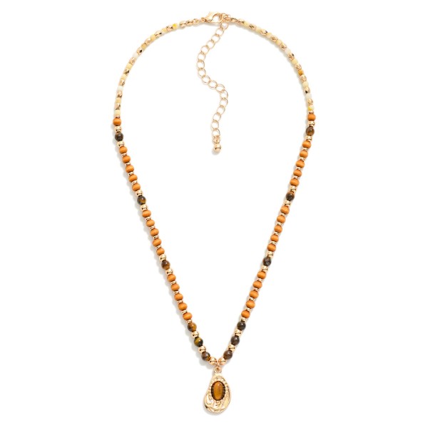 Wood & Stone Beaded Necklace Featuring Teardrop Pendant

- Approximately 14" L
- Extender 2" L