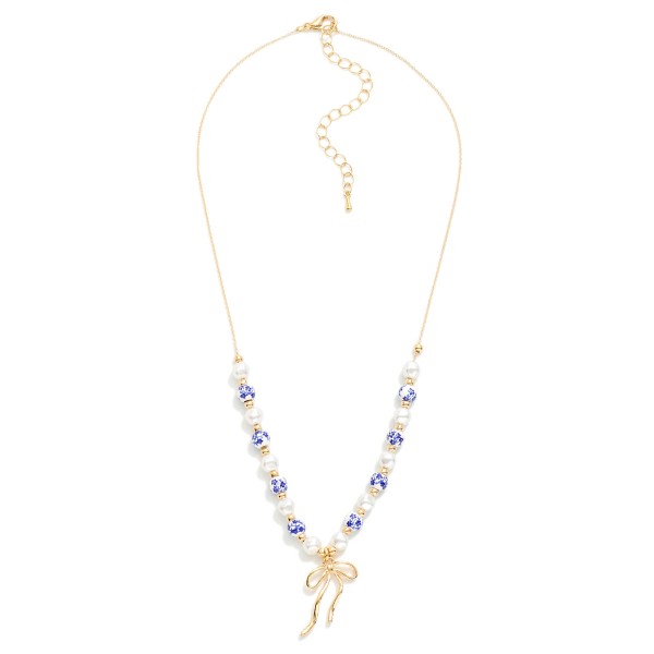 Pearl & Chinoiserie Bead Beaded Chain Link Necklace Featuring Metal Tone Bow Pendant 

- Approximately 16" L
- Extender 2" L