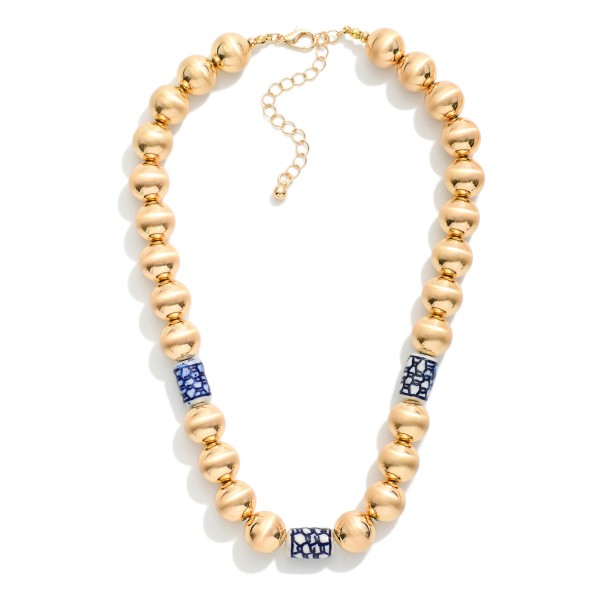 Brushed Metal Bead Beaded Necklace Featuring Chinoiserie Beads

- Approximately 14" L
- Extender 3" L