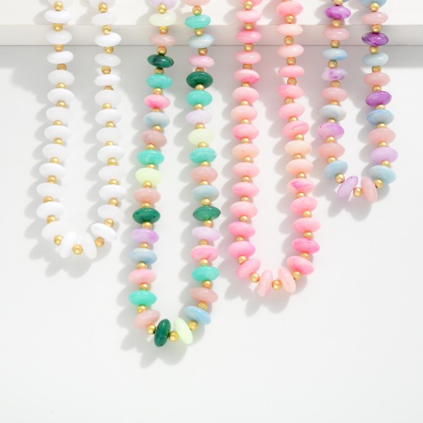 Candy Stone Beaded Necklace Featuring Gold Tone Ball Stations 

- Approximately 14" L 
- Extender 3" L 