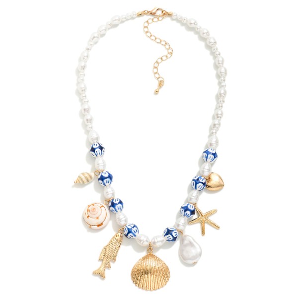 Pearl Beaded Charm Necklace Featuring Painted Porcelain Beads, Metal Tone Sea Animals, & Shell Charms 

- Approximately 14" L
- Extender 2" L