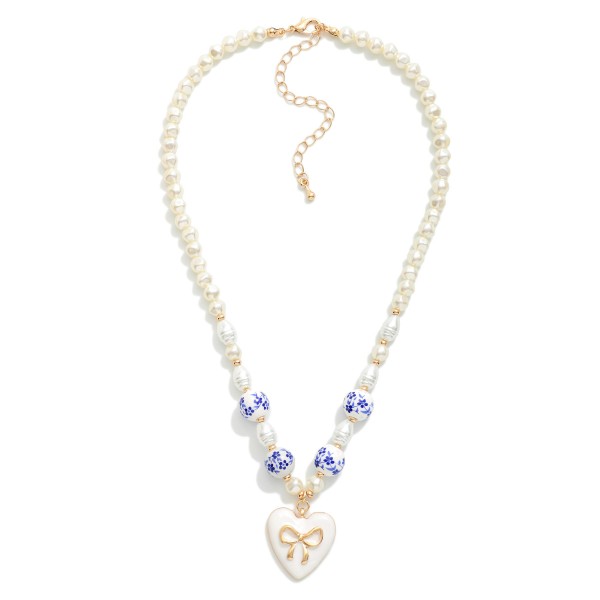 Pearl Beaded Necklace With Chinoiserie Beads & Enamel Heart Bow Pendant 

- Approximately 14" L
- Extender 3" L