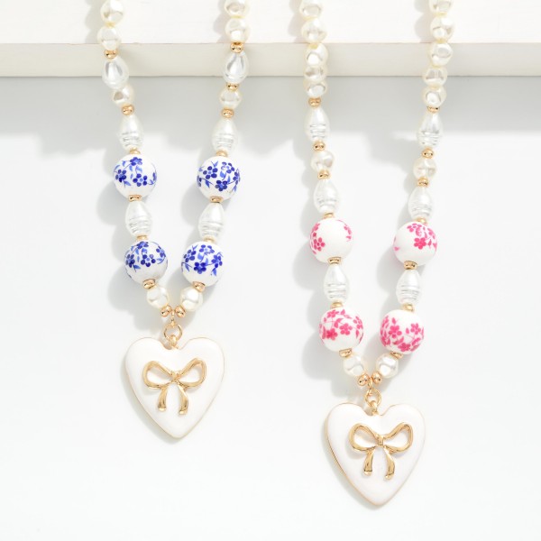 Pearl Beaded Necklace With Chinoiserie Beads & Enamel Heart Bow Pendant 

- Approximately 14" L
- Extender 3" L