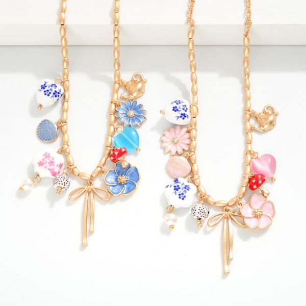 Metal Tone Chain Link Beaded Necklace Featuring Porcelain And Metal Tone Charms 

- Approximately 16" L 
- Extender 3" L 