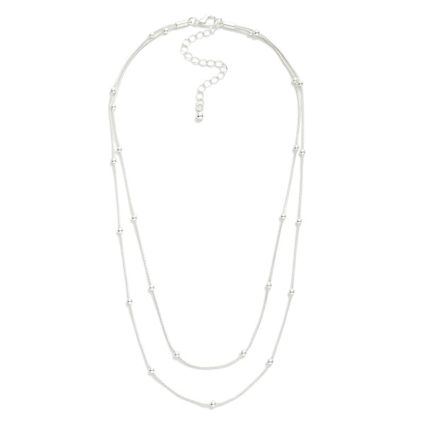 Layered Chain Link Necklace Featuring Metal Tone Ball Stations 

- Approximately 16" L
- Extender 2" L