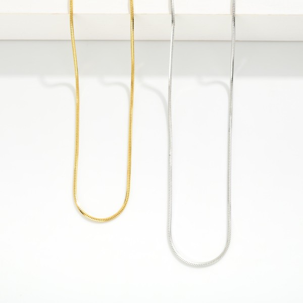 Layered Snake Chain Necklace 

- Stainless Steel
- Water Resistant
- Approximately 15.5" L
- Extender 2" L