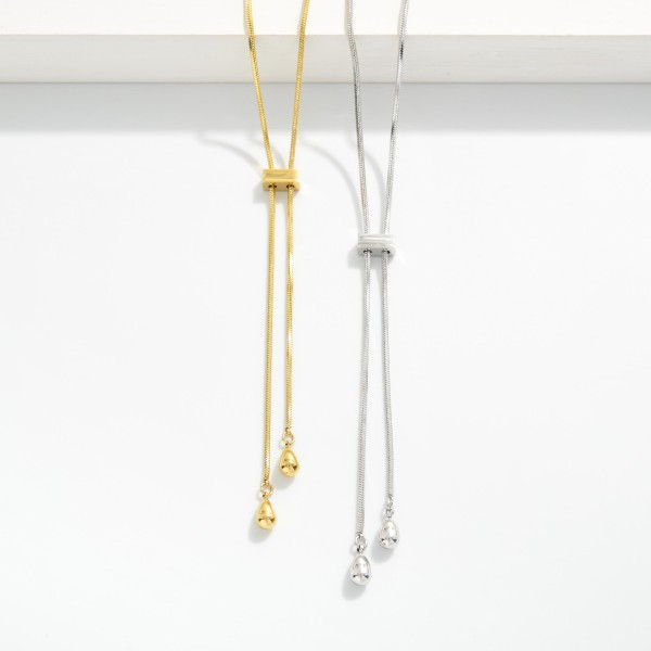 Snake Chain Bolo Style Necklace 

- Approximately 24" L 
- Stainless Steal 
- Water  Resistant 

