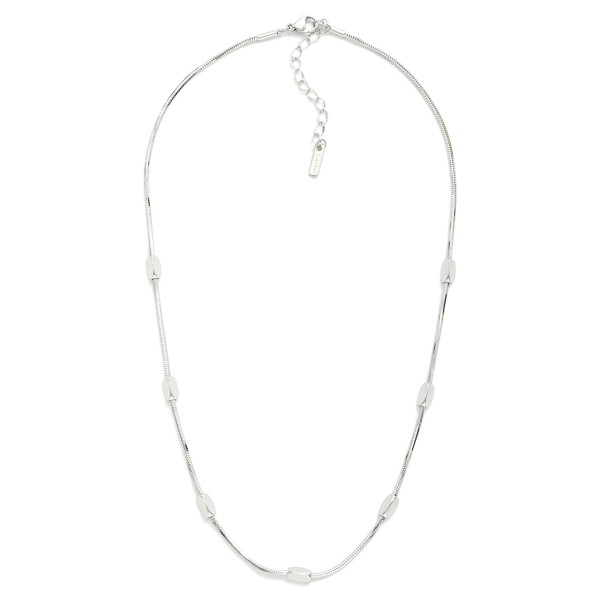 Chain Link Necklace Featuring Metal Tone Geometric Shape Stations

- Stainless Steel
- Water Resistant
- Approximately 15.5" L
- Extender 2" L