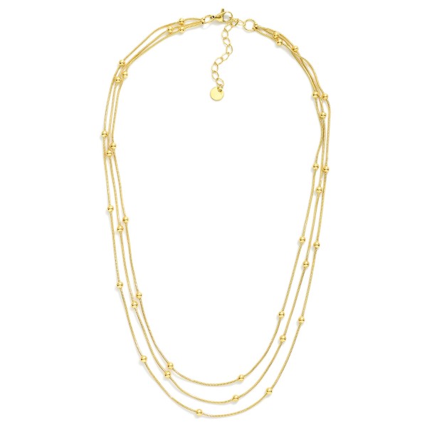 Layered Chain Link Necklace Featuring Metal Tone Ball Stations

- Stainless Steel
- Water Resistant
- Approximately 15.5" L
- Extender 2" L