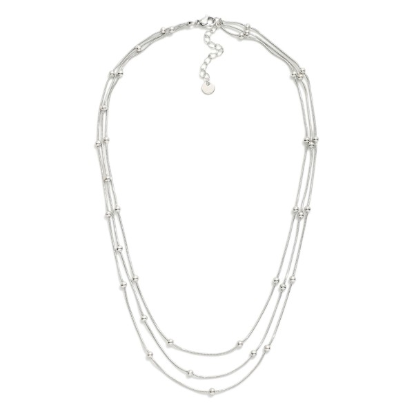 Layered Chain Link Necklace Featuring Metal Tone Ball Stations

- Stainless Steel
- Water Resistant
- Approximately 15.5" L
- Extender 2" L