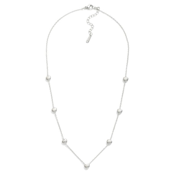 Chain Link Necklace Featuring Puffy Heart Stations  

- Stainless Steel
- Water Resistant
- Approximately 14" L
- Extender 2" L