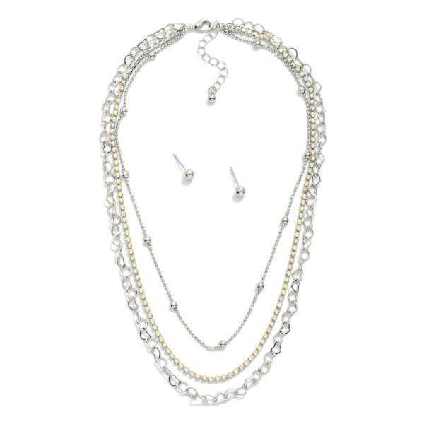 Layered Multi Chain Link Necklace Featuring Rhinestones & Linked Hearts 

- Metal Tone Ball Studs Included 
- Approximately 16" L
- Extender 2" L