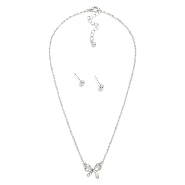 Chain Link Necklace Featuring Metal Tone & Rhinestone Bow Pendant 

- Gold Ball Studs Included
- Approximately 16" L
- Extender 2" L 