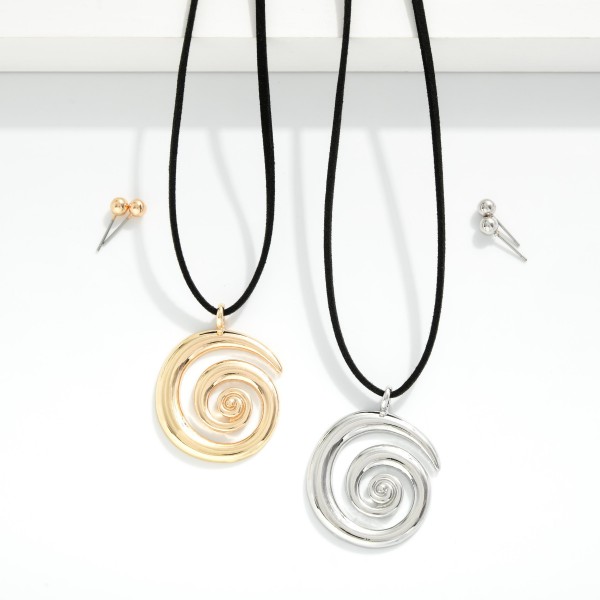 Vegan Leather Wrap Necklace Featuring Metal Tone Swirl Pendant 

- Metal Tone Ball Studs Included 
- Approximately 32" L
