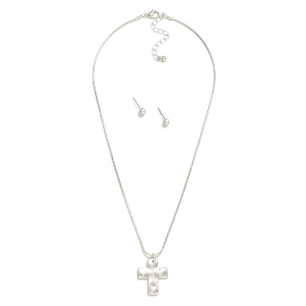 Snake Chain Link Necklace Featuring Hammered Metal Cross Pendant 

- Metal Tone Ball Studs Included 
- Approximately 16" L
- Extender 2" L