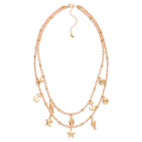 Layered Beaded Necklace Featuring Metal Beach Charms, Faceted Bead & Gold Tones 

- Approximately 18" L 
- Extender 3" L 