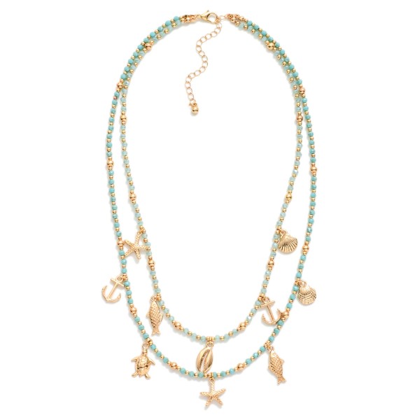 Layered Beaded Necklace Featuring Metal Beach Charms, Faceted Bead & Gold Tones 

- Approximately 18" L 
- Extender 3" L 