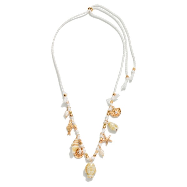 Adjustable Twine Braided Necklace Featuring Beach Charms, old Tones, & Pearls 

- Approximately 22" L 
- One Size Fits Most 