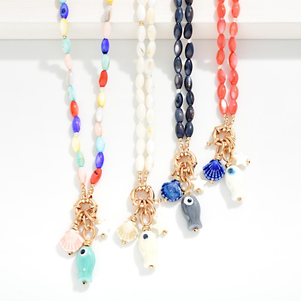 Marbled Rice Bead Necklace Featuring Porcelain Beach Pendants 

- Approximately 16" L
- Extender 3" L